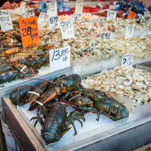 Assorted seafood including lobsters and shrimps on display at a New York market.